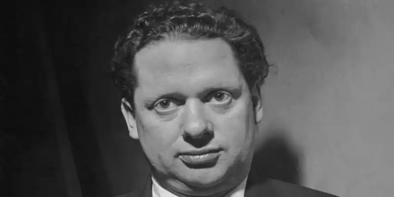 Black and white photograph of Dylan Thomas gazing at the camera